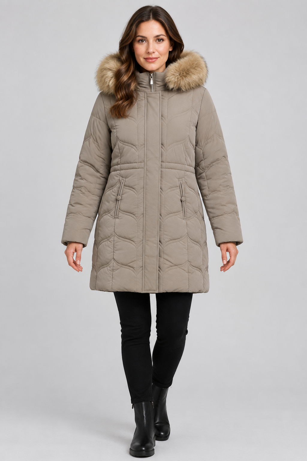 Model wearing a taupe quilted hooded women's jacket